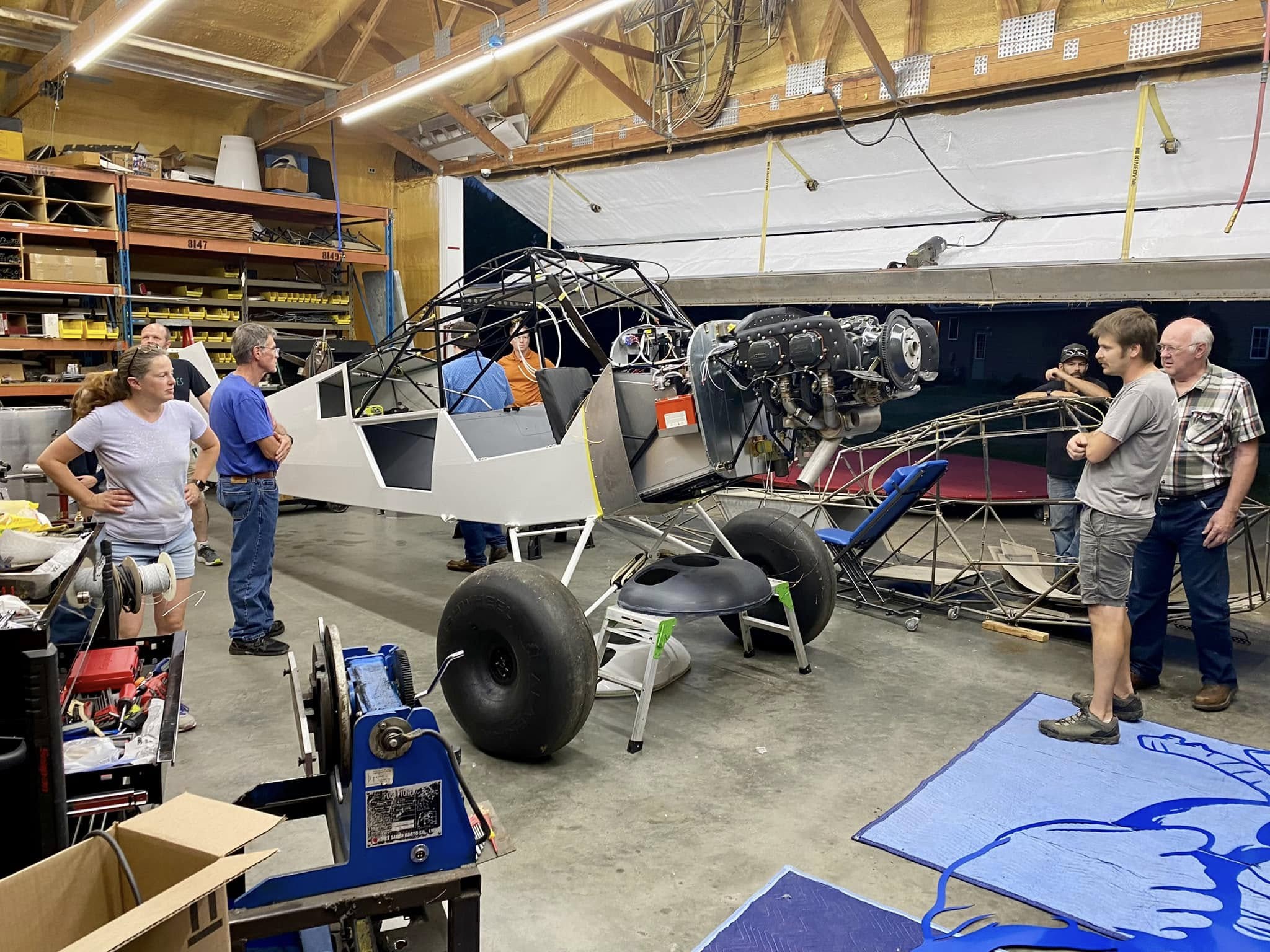 Club members touring an aircraft workshop